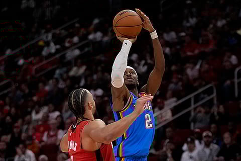 NBA: Thunder guard Shai Gilgeous-Alexander (2) shoots against Rockets forward Dillon Brooks