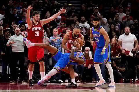 NBA: Rockets forward Dillon Brooks (9) and Thunder guard Shai Gilgeous-Alexander try to get control of the ball