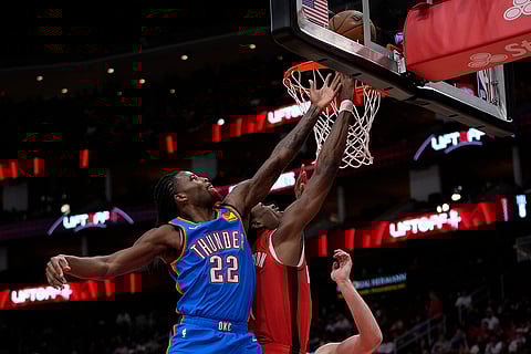 NBA: Rockets forward Amen Thompson shoots against Thunder guard Cason Wallace