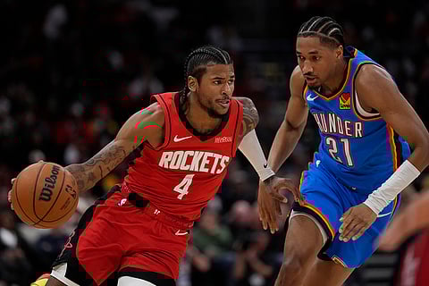 NBA: Rockets guard Jalen Green (4) controls the ball against Thunder guard Aaron Wiggins