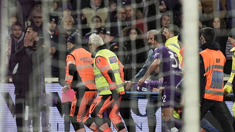 Fiorentinas Edoardo Bove, injured, is transported to a waiting ambulance. AP
