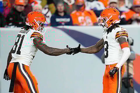 NFL: Browns Jerry Jeudy (3) celebrates his 70-yard pass reception for a touchdown with Michael Woods II