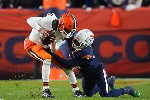 NFL: Browns quarterback Jameis Winston (5) is sacked by Broncos linebacker Nik Bonitto