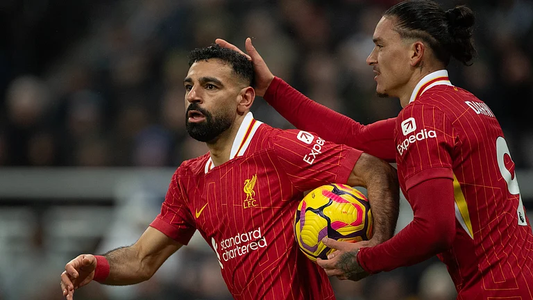 Mohamed Salah celebrates the first of his two goals versus Newcastle United - null
