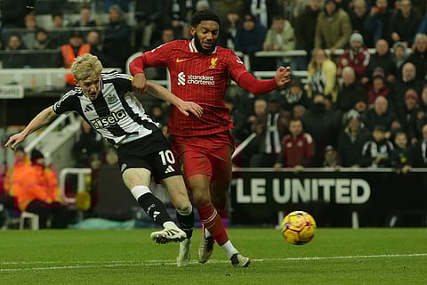 EPL 2024-25: Newcastle's Anthony Gordon, left, duels for the ball with Liverpool's Joe Gomez
