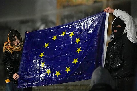 Pro-EU protests in Georgia: Demonstrators hold a EU flag during a rally