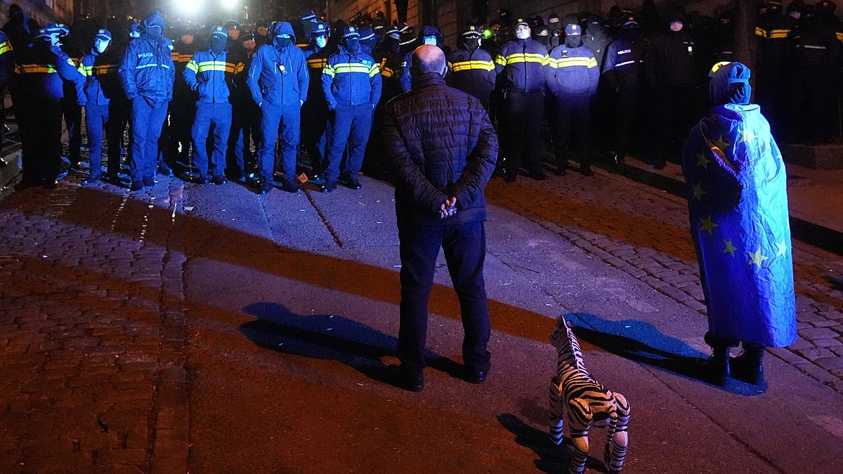 AP : Police block demonstrators during a rally outside the parliament to protest the government's decision to suspend negotiations on joining the European Union in Tbilisi, Georgia, on Wednesday, Dec. 4, 2024.