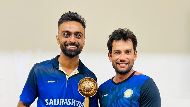 Photo: X | Jaydev Unadkat : Saurashtra captain Jaydev Unadkat with Sheldon Jackson.