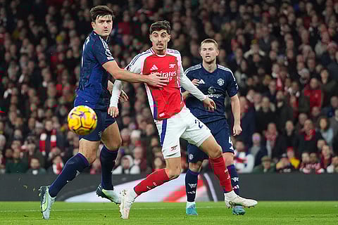 EPL 2024-25: Manchester United's Harry Maguire and Arsenal's Kai Havertz challenge for the ball