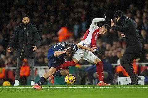 EPL 2024-25: United's Manuel Ugarte and Arsenal's Gabriel Martinelli challenge for the ball