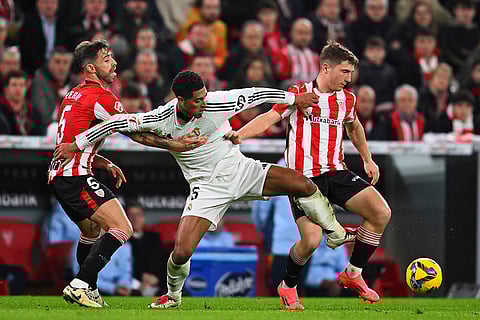 La Liga 2024-25: Mikel Jauregizar, right, and Yeray Alvarez, left, challenge Jude Bellingham