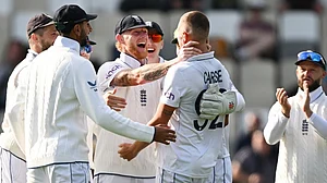 AP/Andrew Cornaga : England celebrate the wicket of New Zealand batter Kane Williamson during the first day of the second Test in Wellington.