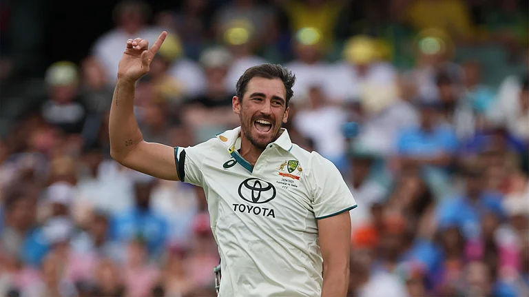 Australia's Mitchell Starc celebrates the dismissal of India's Ravichandran Ashwin during day one of the second cricket test match between Australia and India at the Adelaide Oval in Adelaide. - AP Photo/James Elsby