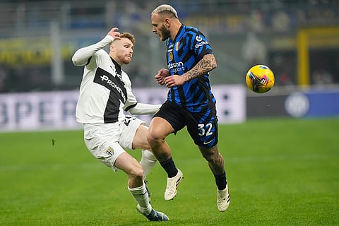 Italy Serie A 2024-25: Inter Milan's Federico Dimarco, right, and Parma's Antoine Hainaut vie for the ball