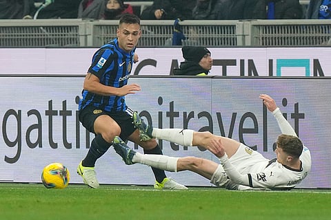 Italy Serie A 2024-25: Inter Milan's Lautaro Martinez and Parma's Antoine Hainaut vie for the ball