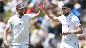 Atkinson (right) celebrates with Woakes