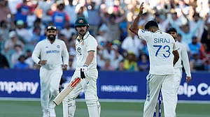 AP/James Elsby : Mohammed Siraj (right) gives Travis Head a send-off after dismissing him during the second day of the second Test between India and Australia in Adelaide.