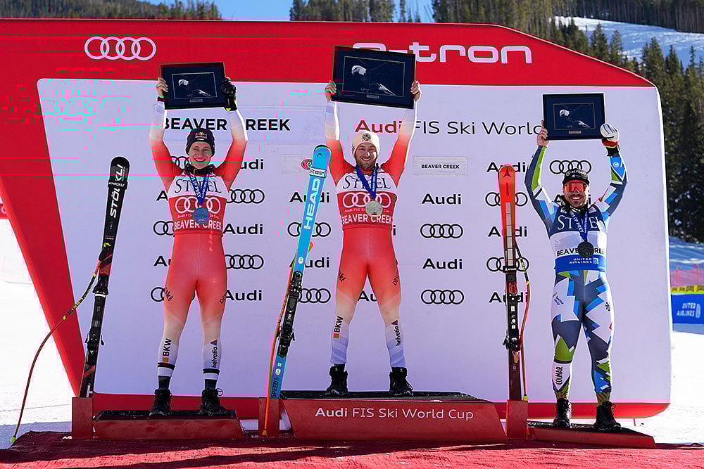 | Photo: AP/Robert F. Bukaty : FIS Alpine Ski World Cup: Second placed Switzerland's Marco Odermatt, first placed Switzerland's Justin Murisier, and third placed Slovenia's Miha Hrobat