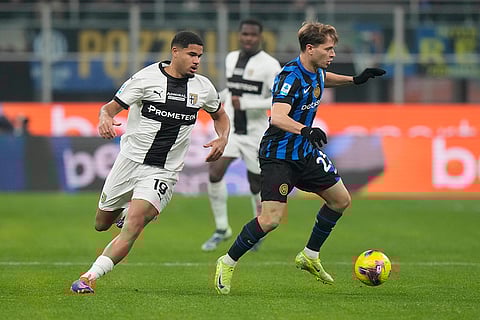 Italy Serie A 2024-25: Parma's Simon Sohm, left, and Inter Milan's Nicolo Barella vie for the ball