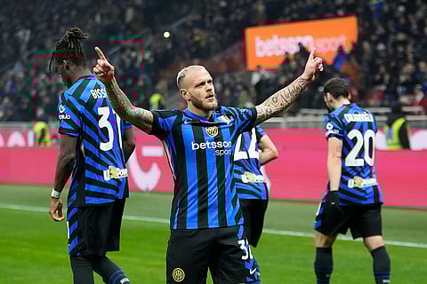 Italy Serie A 2024-25: Inter Milan's Federico Dimarco, left, celebrates with teammates after scoring