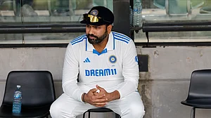 AP Photo/James Elsby : India's captain Rohit Sharma reacts after their loss in the second cricket test match against Australia at the Adelaide Oval in Adelaide.