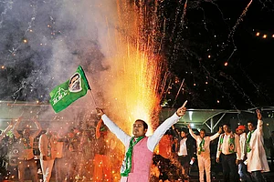 Photo: Anupam Parshant minz : Challenges Ahead: A supporter of the Jharkhand Mukti Morcha celebrating the victory