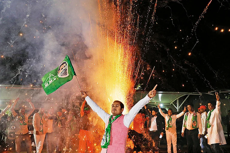 Challenges Ahead: A supporter of the Jharkhand Mukti Morcha celebrating the victory - Photo: Anupam Parshant minz
