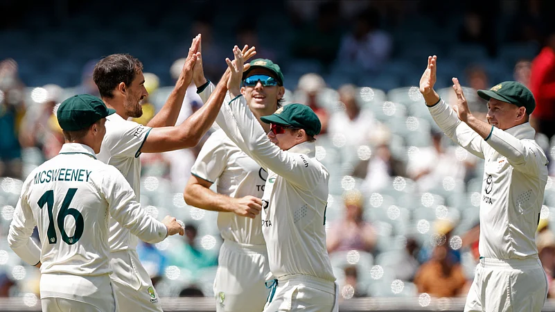 Australias Mitchell Starc, second left, celebrates with teammates. AP Photo