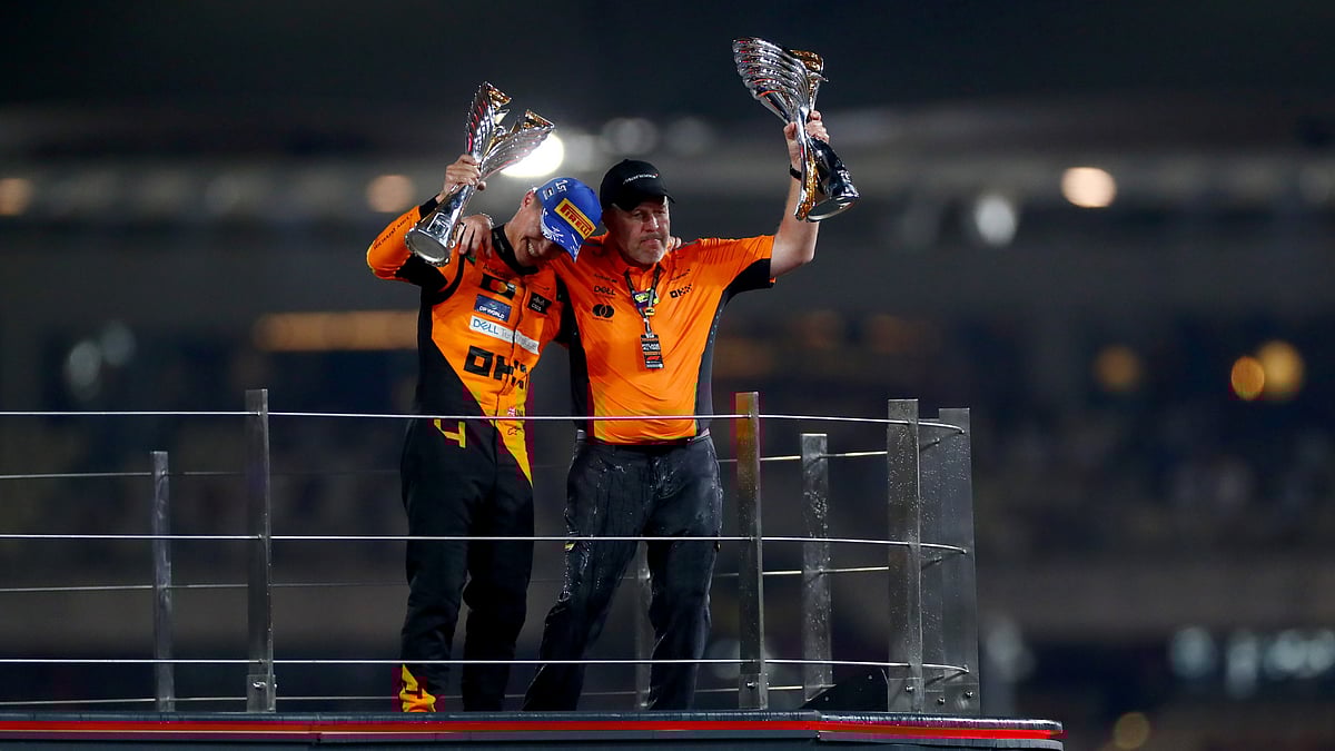 McLaren boss Zack Brown and driver Lando Norris on the podium.  - X | F1 