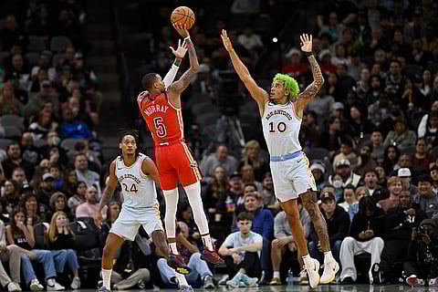 NBA Pelicans vs Spurs Basketball: Pelicans' Dejounte Murray (5) shoots against Spurs' Jeremy Sochan (10)