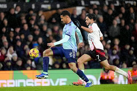 EPL 2024-25, FUL vs ARS: Fulham's Raul Jimenez, right, challenges for the ball with Arsenal's William Saliba