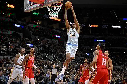 NBA Pelicans vs Spurs Basketball: Spurs' Devin Vassell (24) dunks