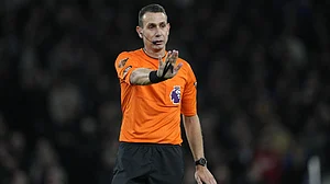 AP : File photo of referee David Coote officiating during an English Premier League match.