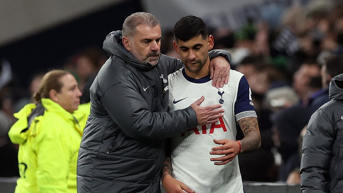 Tottenham manager Ange Postecoglou with defender Cristian Romero