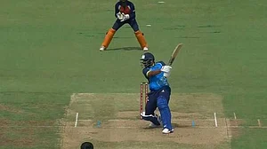 X/BCCIdomestic : Mohammed Shami hits a boundary during Bengal's SMAT 1st pre-quarterfinal against Chandigarh on Monday.