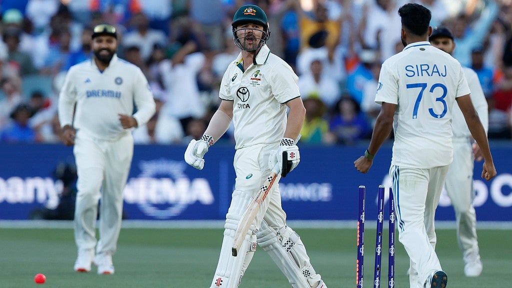 Mohammed Siraj (right) gives Travis Head a send-off after dismissing him during the second day of the second Test between India and Australia in Adelaide. - AP/James Elsby