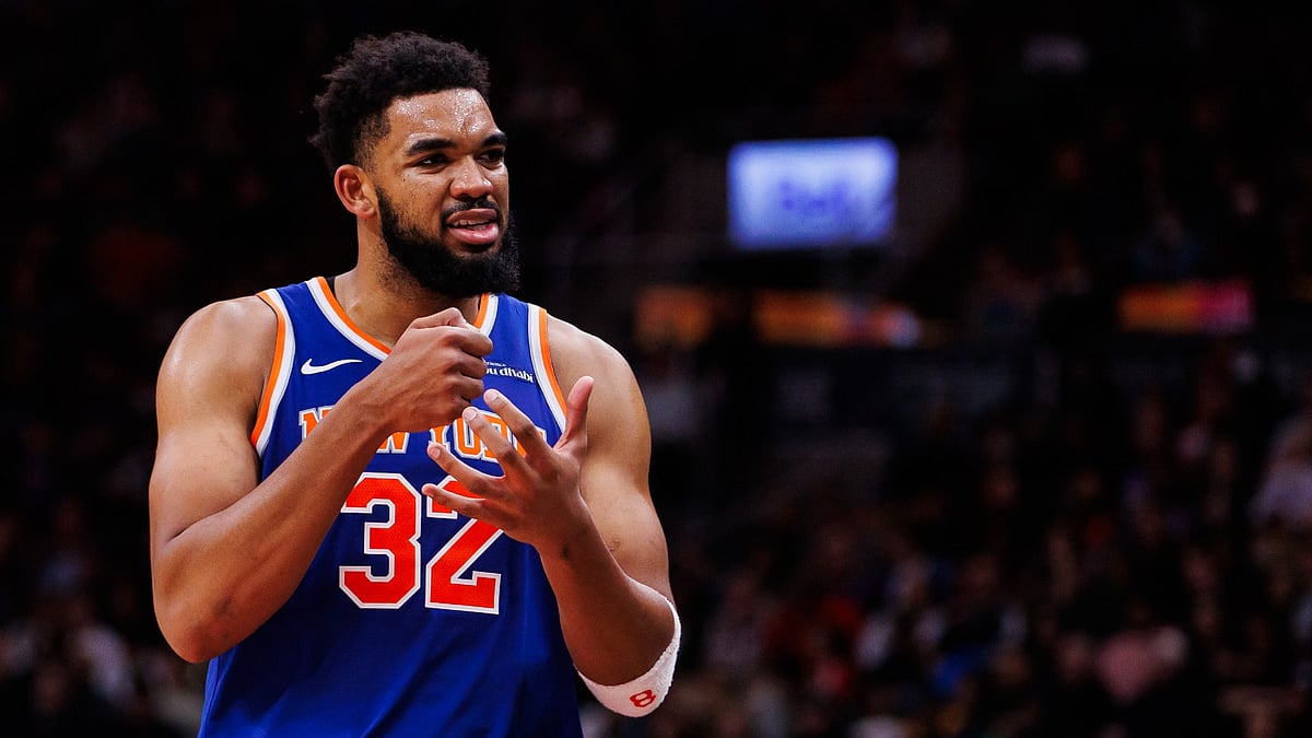 Karl-Anthony Towns #32 of the New York Knicks reacts as he walks to the bench during second half of their NBA game against the Toronto Raptors at Scotiabank Arena on December 9, 2024 in Toronto, Canada.