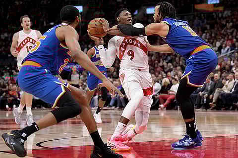 NBA Basketball: Raptors guard RJ Barrett (9) gets fouled by New York Knicks guard Jalen Brunson