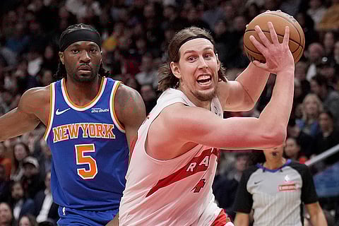 NBA Basketball: Raptors forward Kelly Olynyk (41) drives past Knicks forward Precious Achiuwa