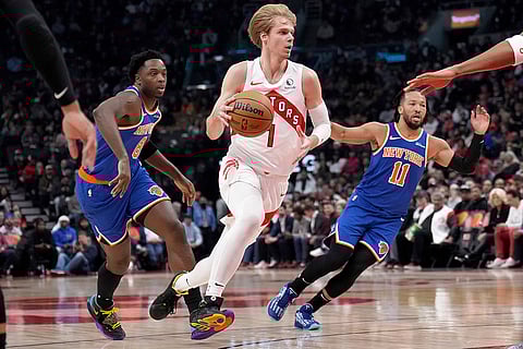 NBA Basketball: Raptors guard Gradey Dick (1) drives past Knicks forward OG Anunoby