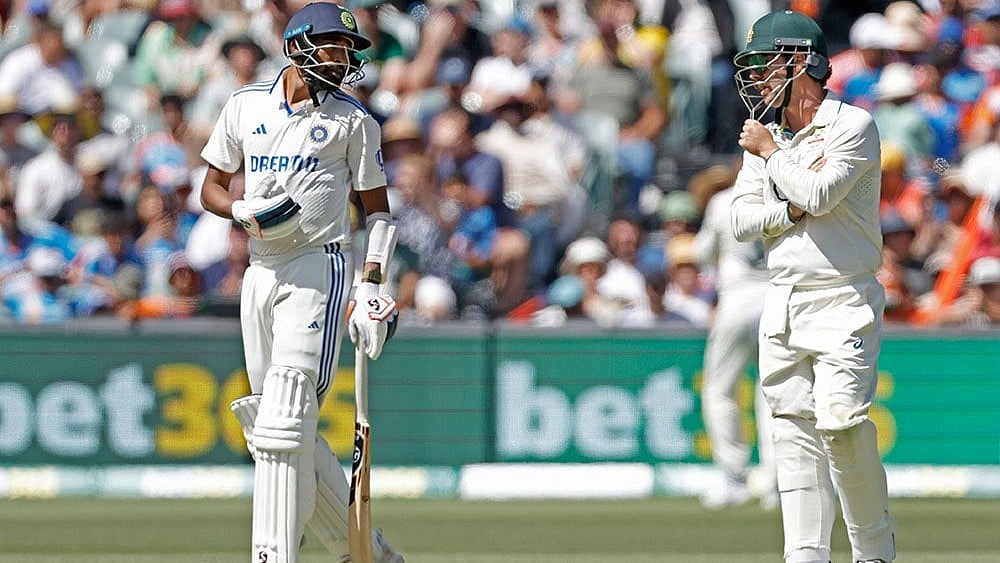 Photo: AP/James Elsby : AUS vs IND: Travis Head (right) and Mohammed Siraj engage in a conversation.