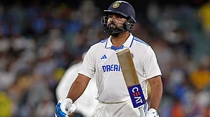 | Photo: AP/James Elsby : IND Vs AUS 2nd Test Day 2: India's captain Rohit Sharma walks off the field after losing his wicket