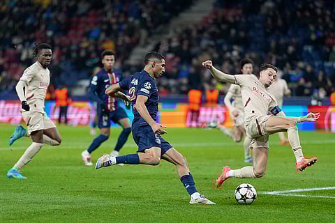 Champions League 2024-25: PSG's Achraf Hakimi, center, kicks a ball