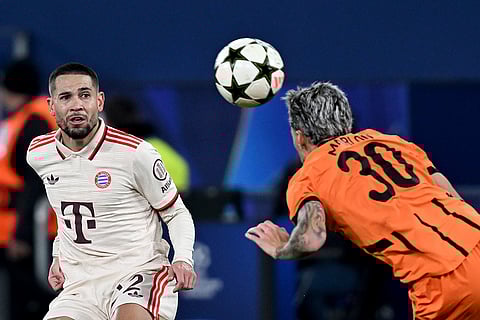 Champions League 2024-25: Bayern's Raphael Guerreiro, left, and Shakhtar's Marlon Gomes challenge for the ball