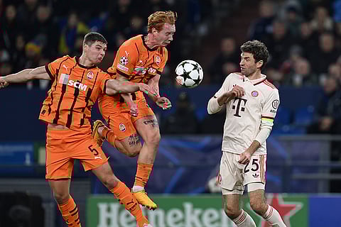 Champions League 2024-25: Bayern's Thomas Muller, right, challenges for the ball with Shakhtar's Valery Bondar