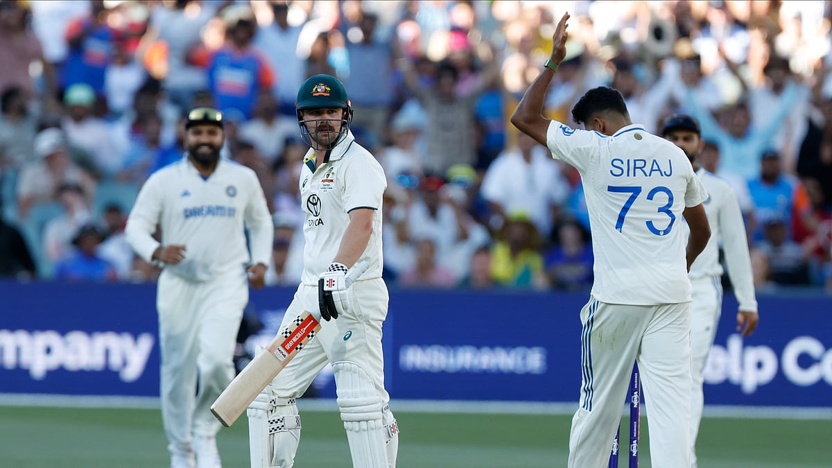Indias Mohammed Siraj celebrates after the dismissal of Travis Head. AP Photo
