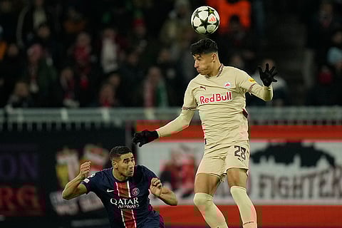 Champions League 2024-25: Salzburg's Adam Daghim heads a ball next to PSG's Achraf Hakimi