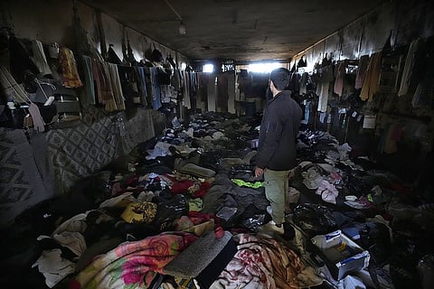 A man looks at a room of the infamous Saydnaya military prison, just north of Damascus, Syria.