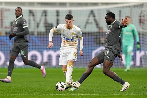 UEFA Champions League: AC Milan's Youssouf Fofana, right, challenges Red Star's Andrija Maksimovic