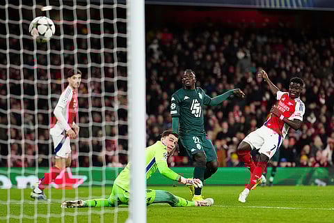 UEFA Champions League: Arsenal's Bukayo Saka, right, scores his side's second goal
